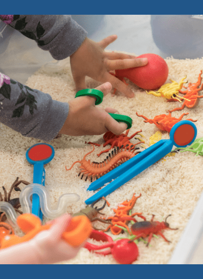 Image of children playing with sensory bin